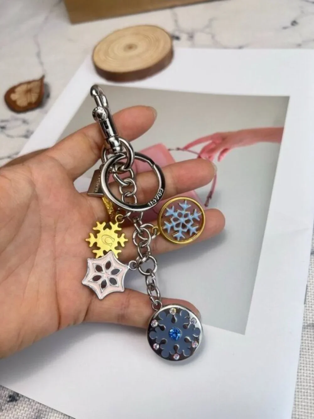 Coach Silver-Tone & Light Blue Snowflake Charm Keychain with Gold Accent